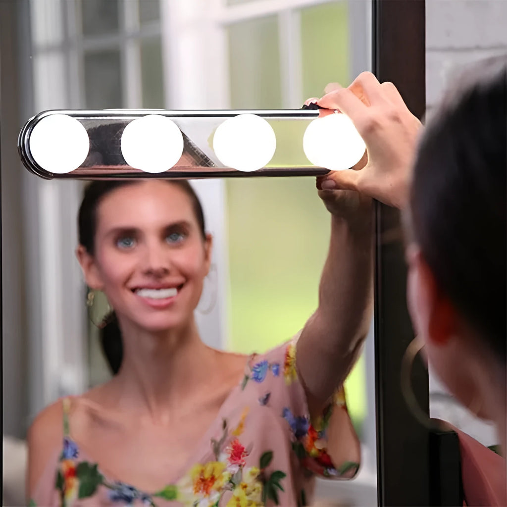 Four bulb round mirror headlight with suction cup mount on a bathroom mirror, ABS housing, cordless LED lamp