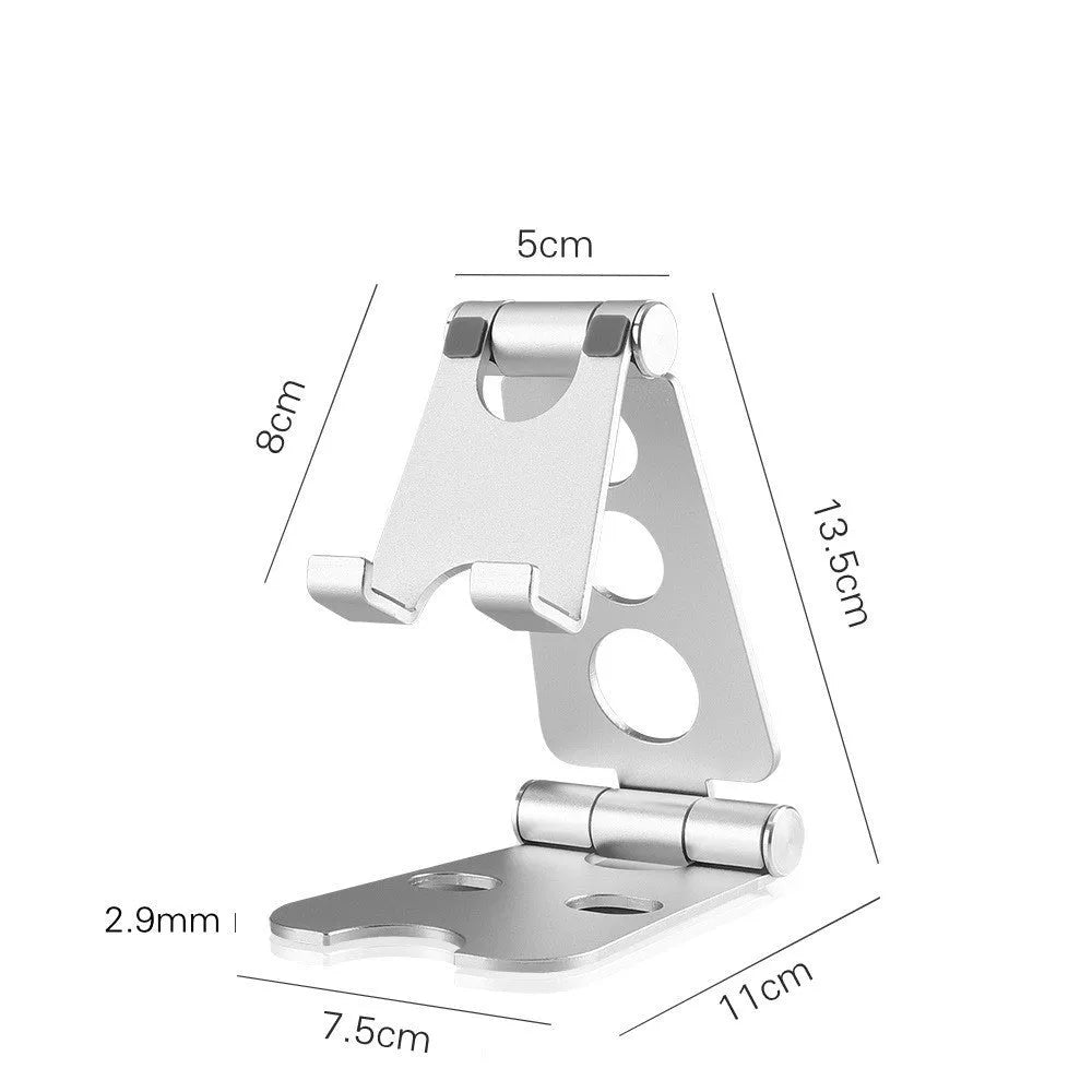 Folding mini mobile phone bracket in black with foldable legs, on a wooden desktop