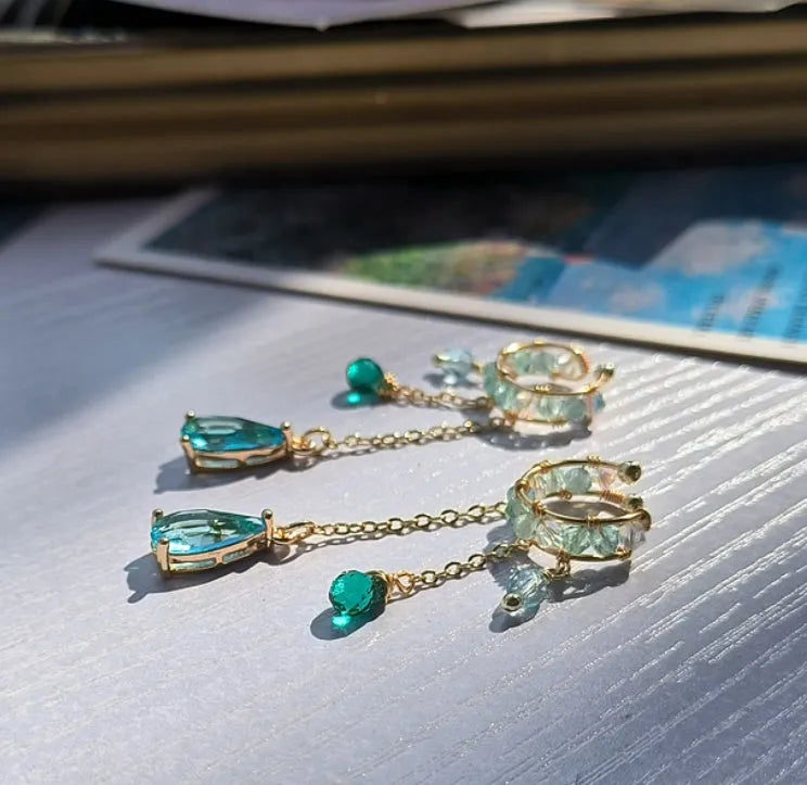 Niche ear clip with lake blue stream streamer in alloy silver plating for left ear original design