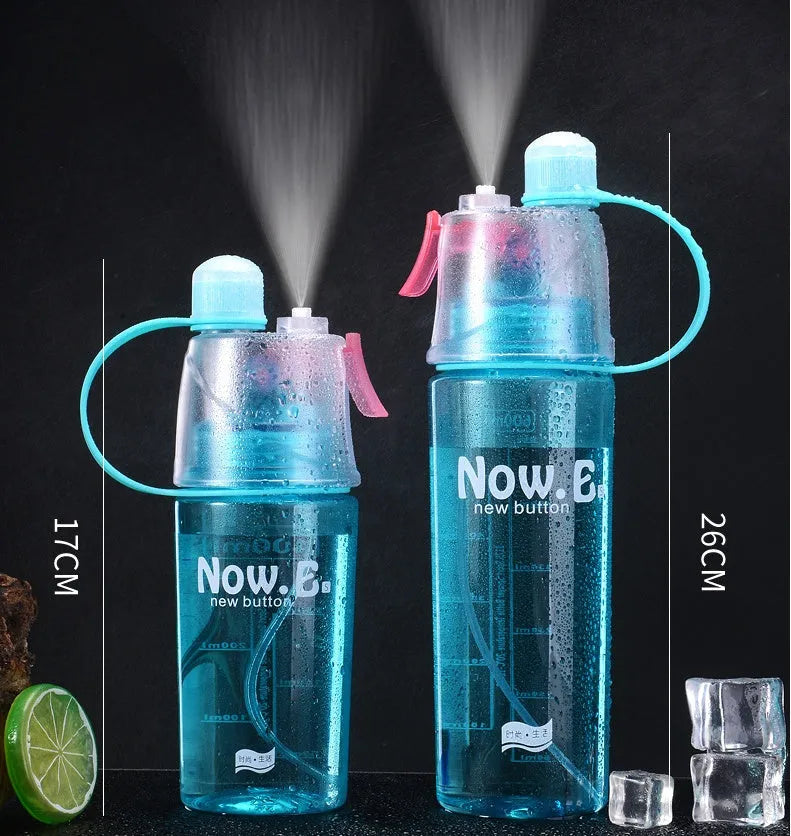 Green portable sports mist spray cup with transparent body, volume scale, handle, and spray mouth.