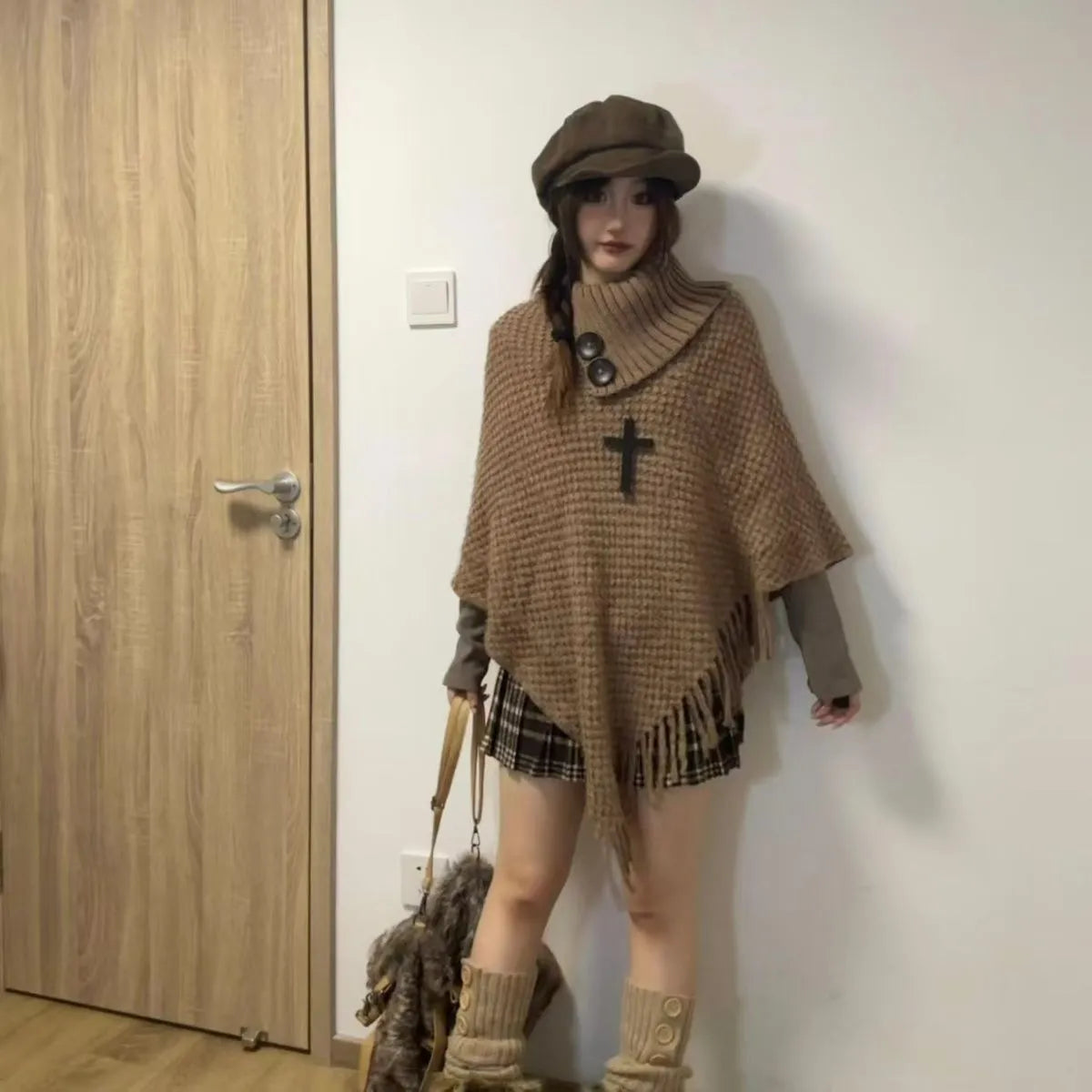 Women's casual plush triangle shawl cape with tassels in a cashmere acrylic blend.