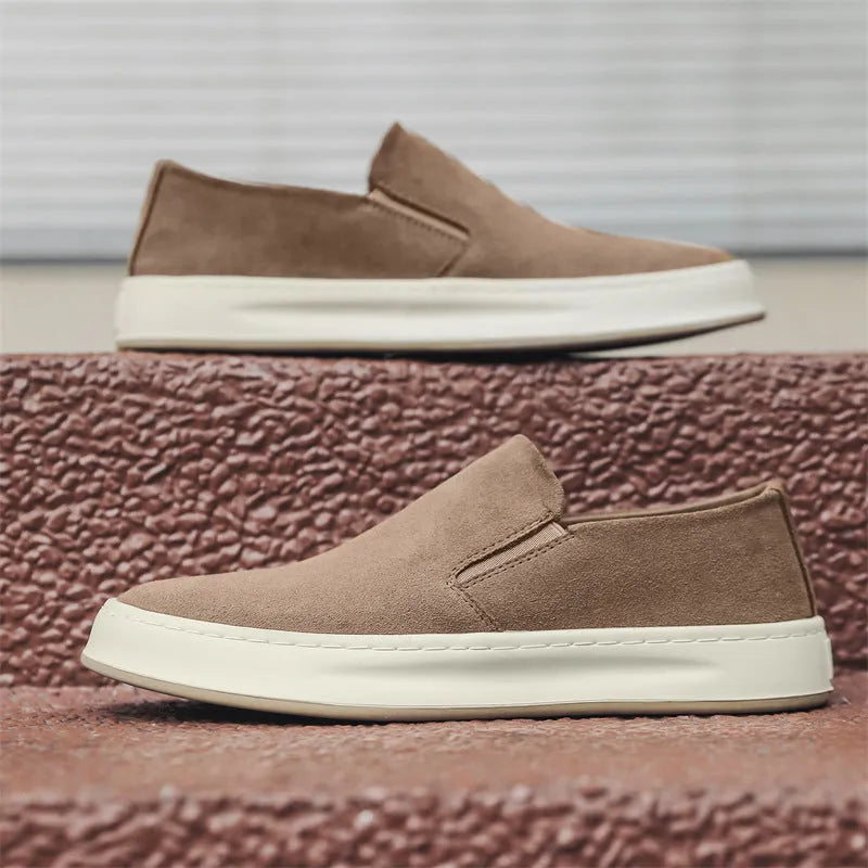 Gray men's casual slip-on shoes with round toe and mid heel on a white background