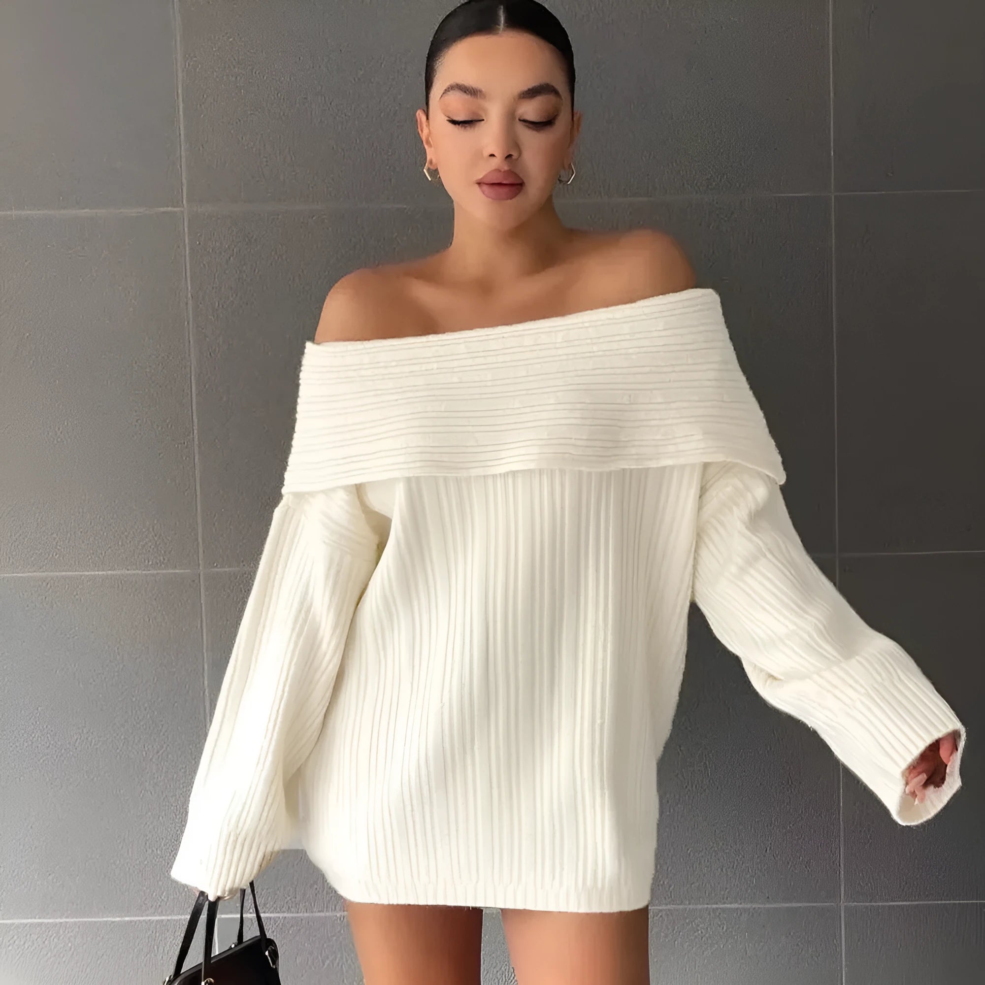 Women's loose long sleeve acrylic pullover sweater in white, shown laid flat.