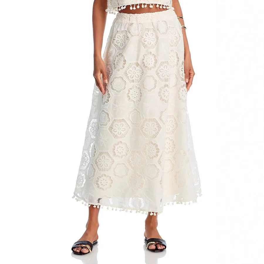 White sleeveless women’s suit with embroidered long skirt and top set