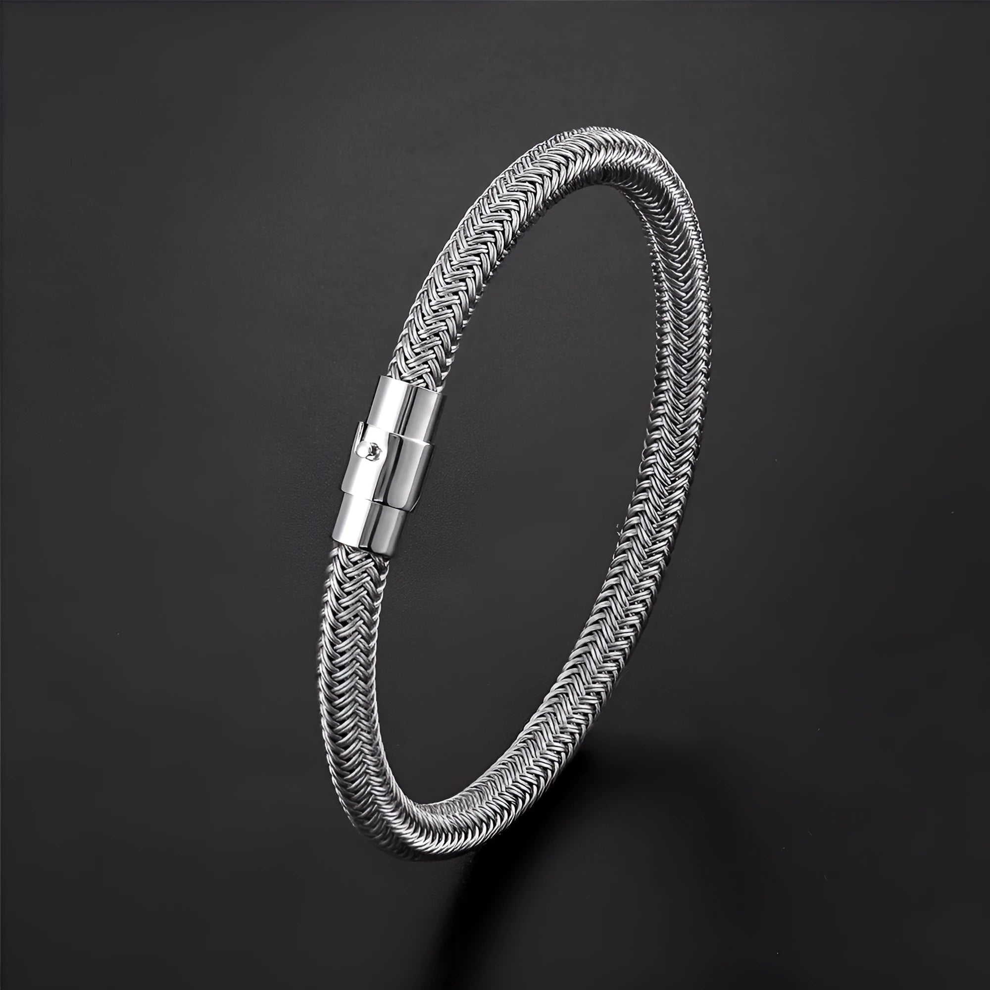 Geometric titanium steel wire bracelet with magnetic clasp on a wrist, showing minimalist unisex design.