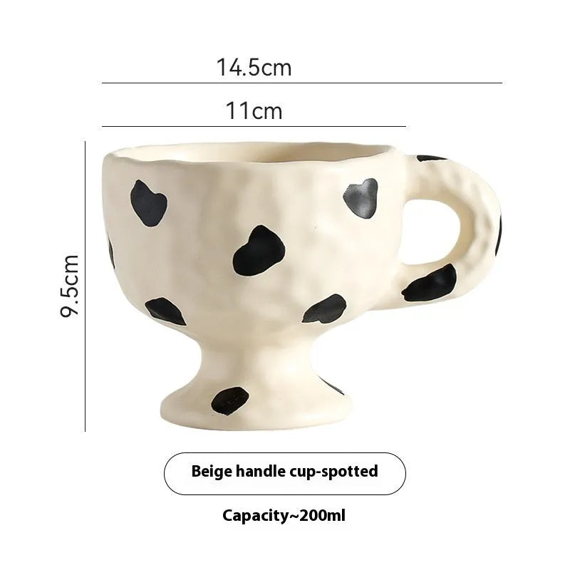 Handmade irregular solid colour ceramic mug on a table