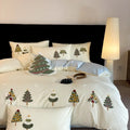Cream blue duvet cover with embroidered Christmas tree and towel pattern, part of a pure cotton four-piece bedding set.