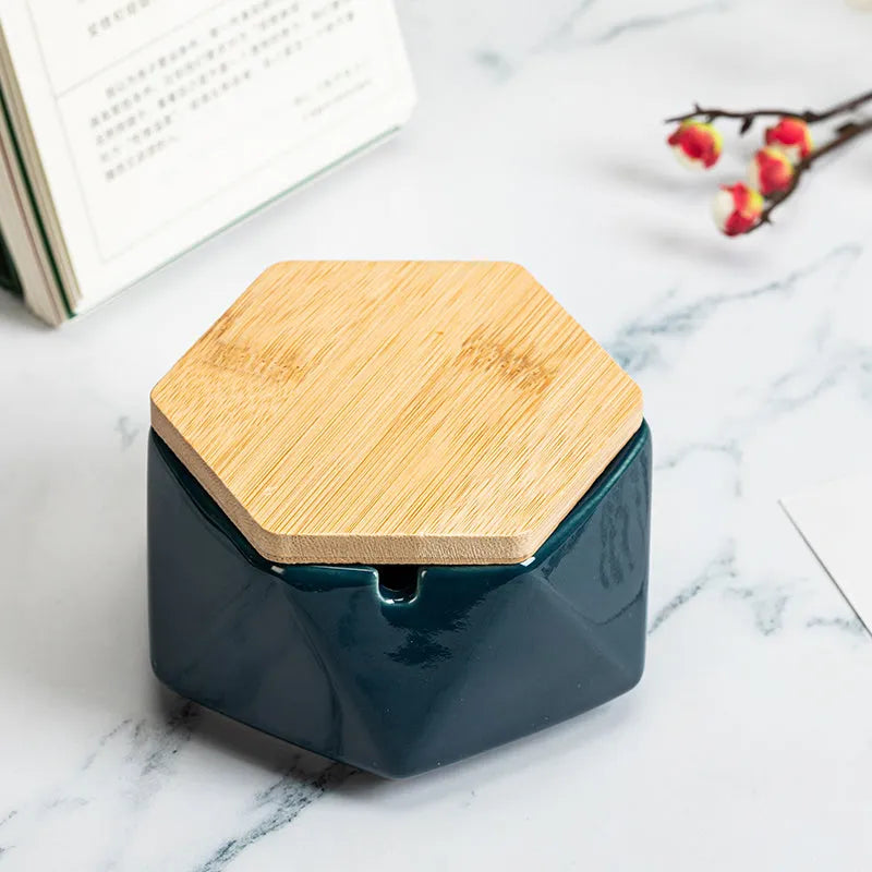 Ceramic ashtray with lid, Nordic style, available in multiple colours, on a tabletop
