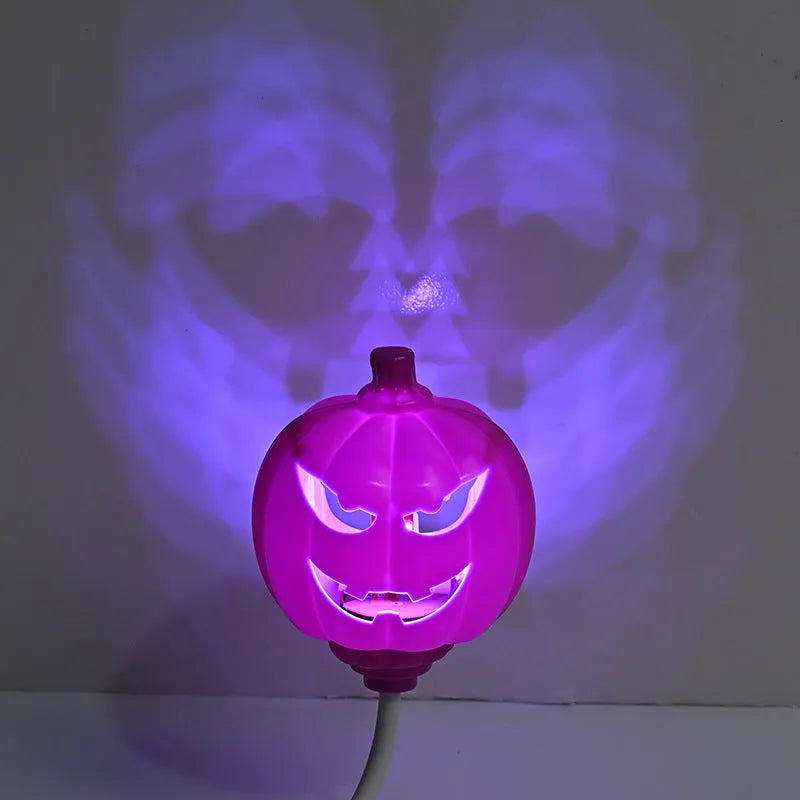 USB rechargeable plastic pumpkin lamp with purple or yellow LED lighting measuring 8.3cm diameter