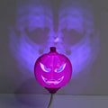 USB rechargeable plastic pumpkin lamp with purple or yellow LED lighting measuring 8.3cm diameter