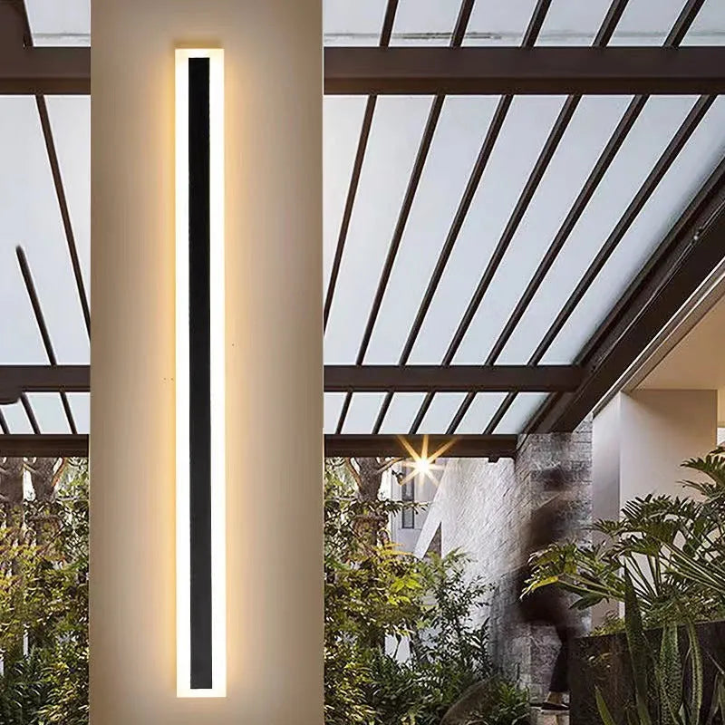 Linear outdoor wall lamp with IP65 waterproof rating and remote control for three light colours.