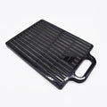 Double large folding hairdressing rearview mirror in black with HD double-sided reflective surface on a table