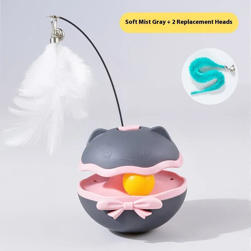 Electric cat toy tumbler ball in soft fog grey colour, showing smooth plastic surface and on/off switch on base.
