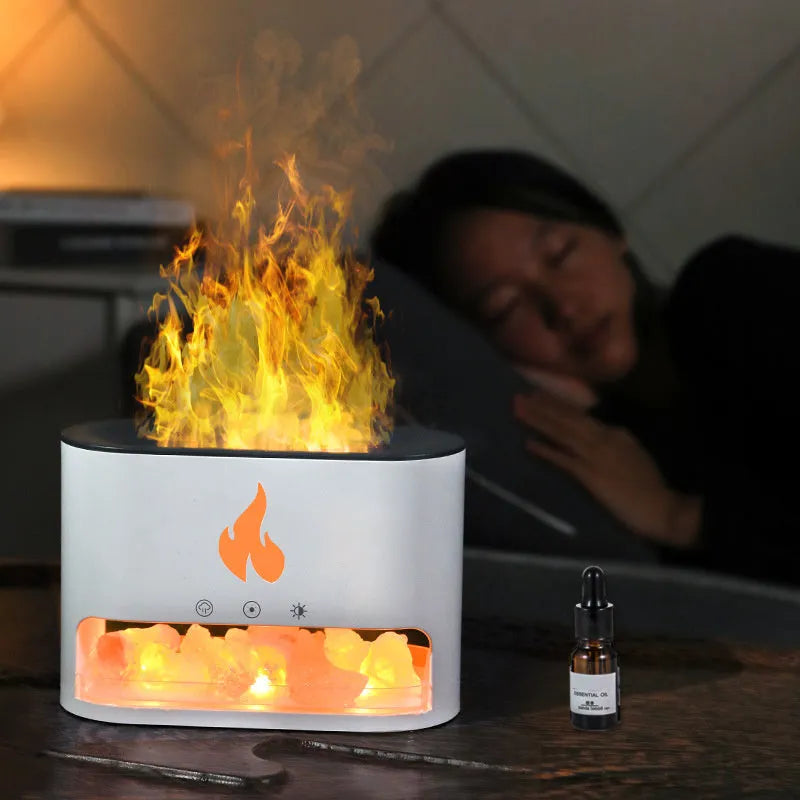 Square white flame humidifier aromatherapy machine with colourful 3D simulation flame on a desk.