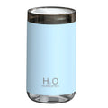 Blue jellyfish humidifier with warm night light and USB cable on wooden table