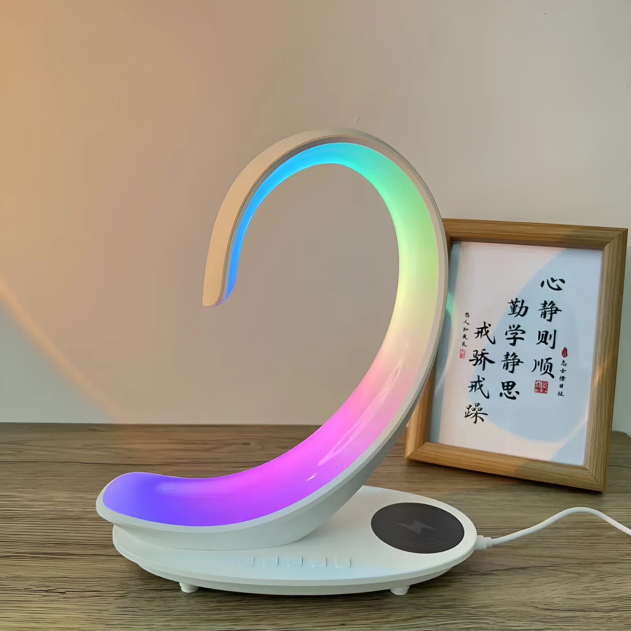 White swan-shaped desktop lamp with wireless charging pad and Bluetooth speaker functions, colourful LED lighting