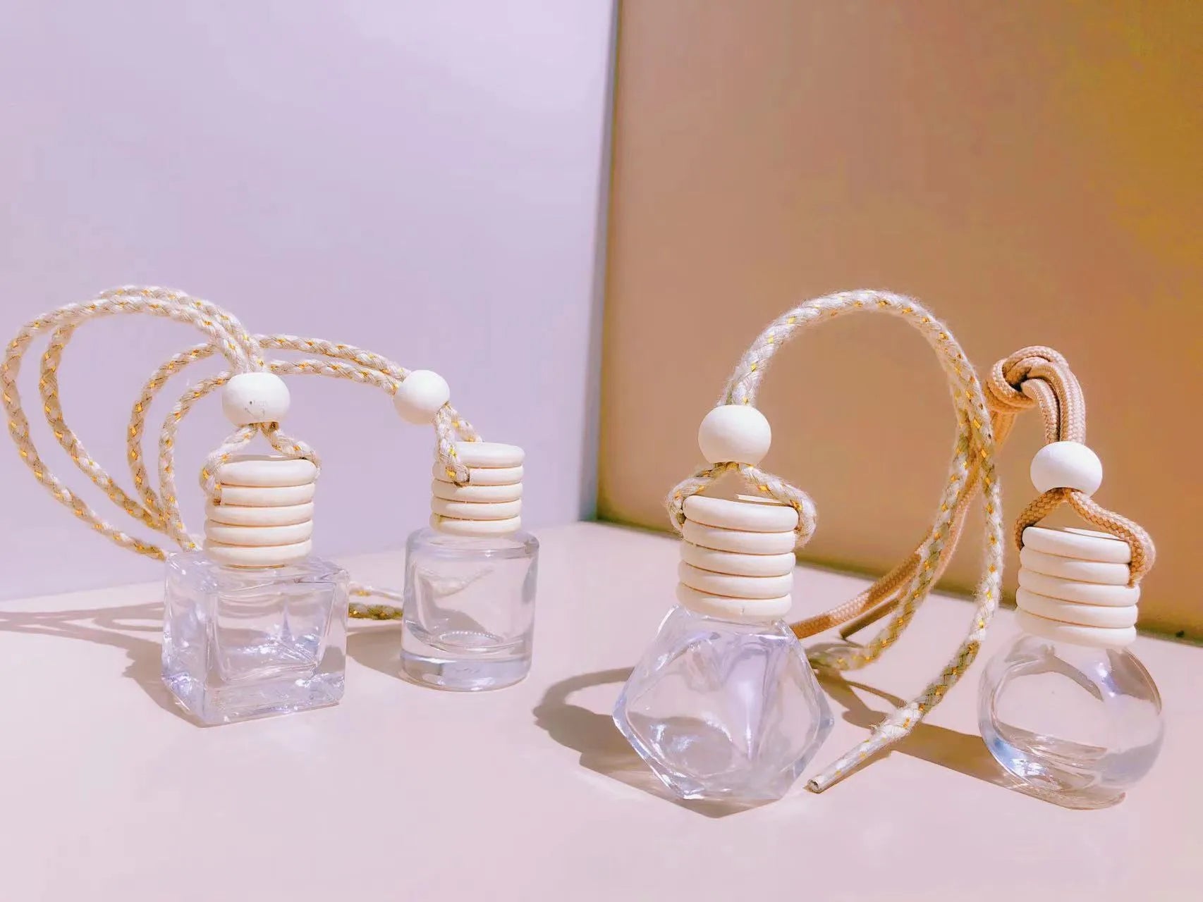 Glass car fragrance pendant showing Cylinder, Diamond, Flat Drum, and Square bottle style options.