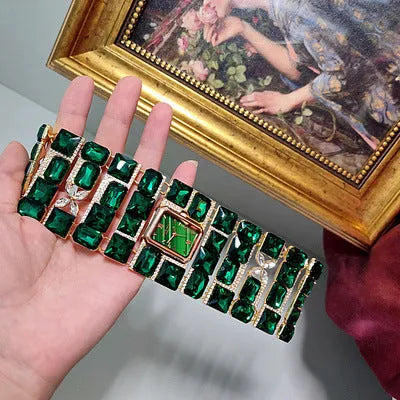 Antique court retro bracelet watch with emerald colored glaze round face and alloy bracelet