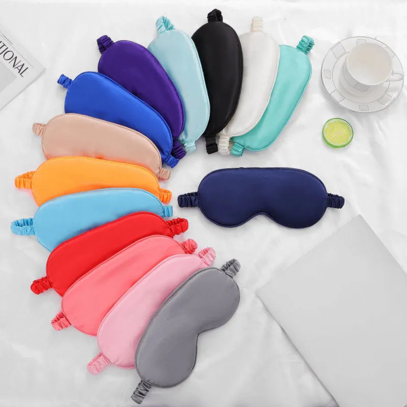 Double-sided silk-like eyeshade in rayon elastic satin shown in multiple colour options including black, beige, and wine red