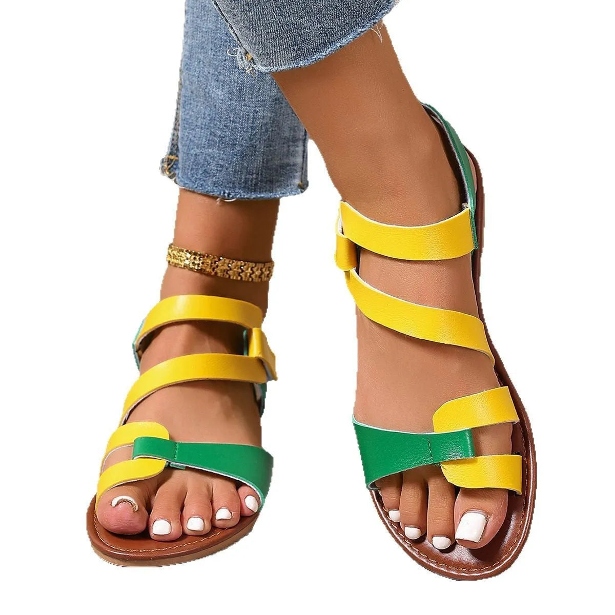 Women's flat sandals with a Velcro strap, in PU leather with a rubber sole.