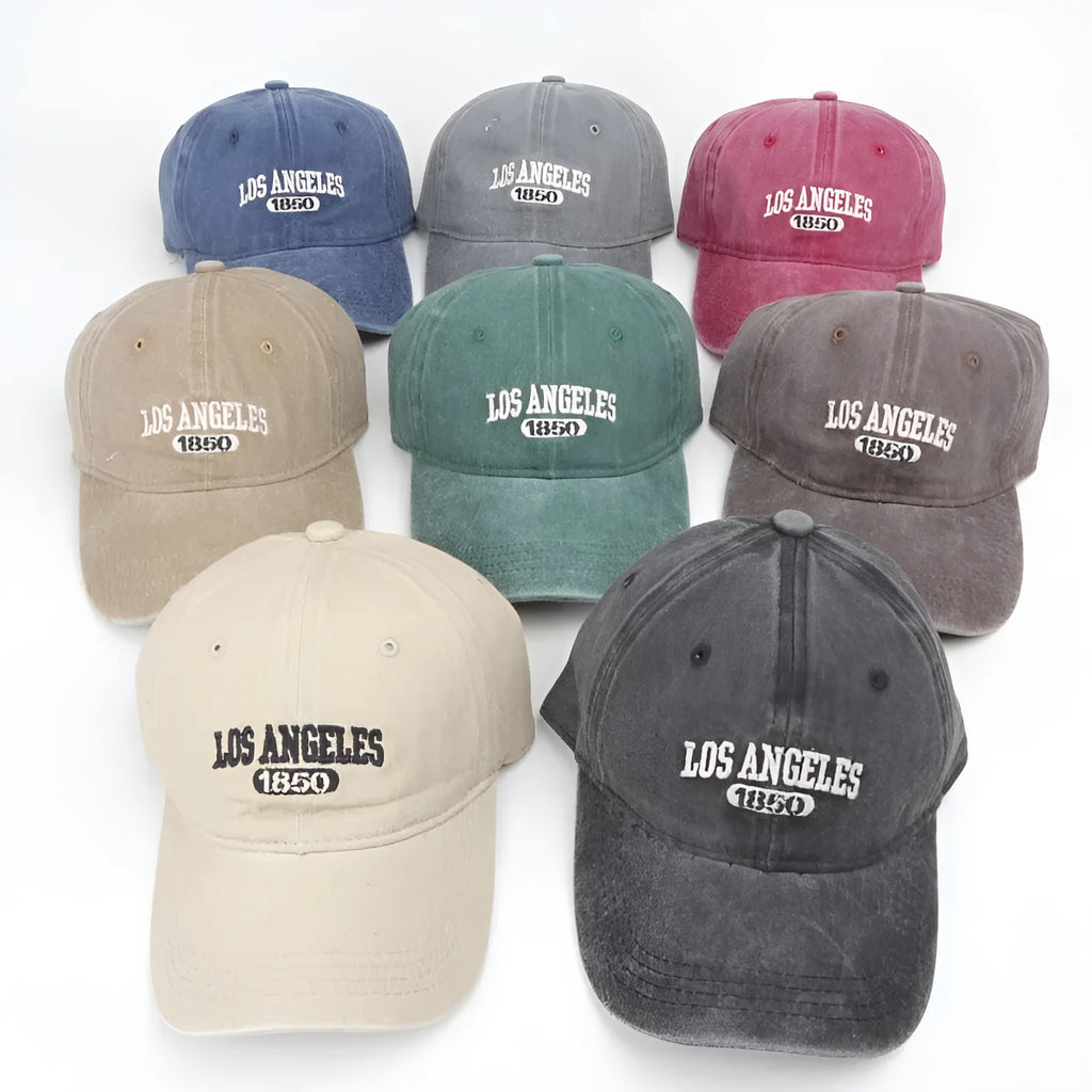 Distressed beige baseball cap with embroidered letters on the front, showing adjustable strap and curved 7cm peak.