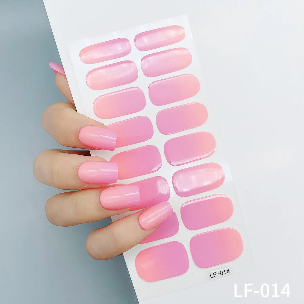 Sheet of solid colour nail stickers showing 16 small designs including a rose, heart, tulip, and cat's paw.