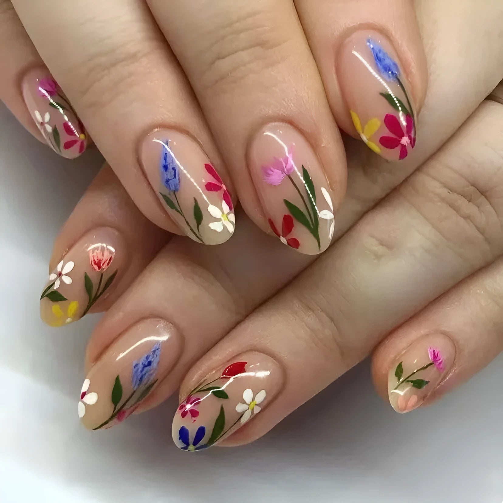 Removable flower pattern nail art set for almond-shaped nails in a rose and tulip design.