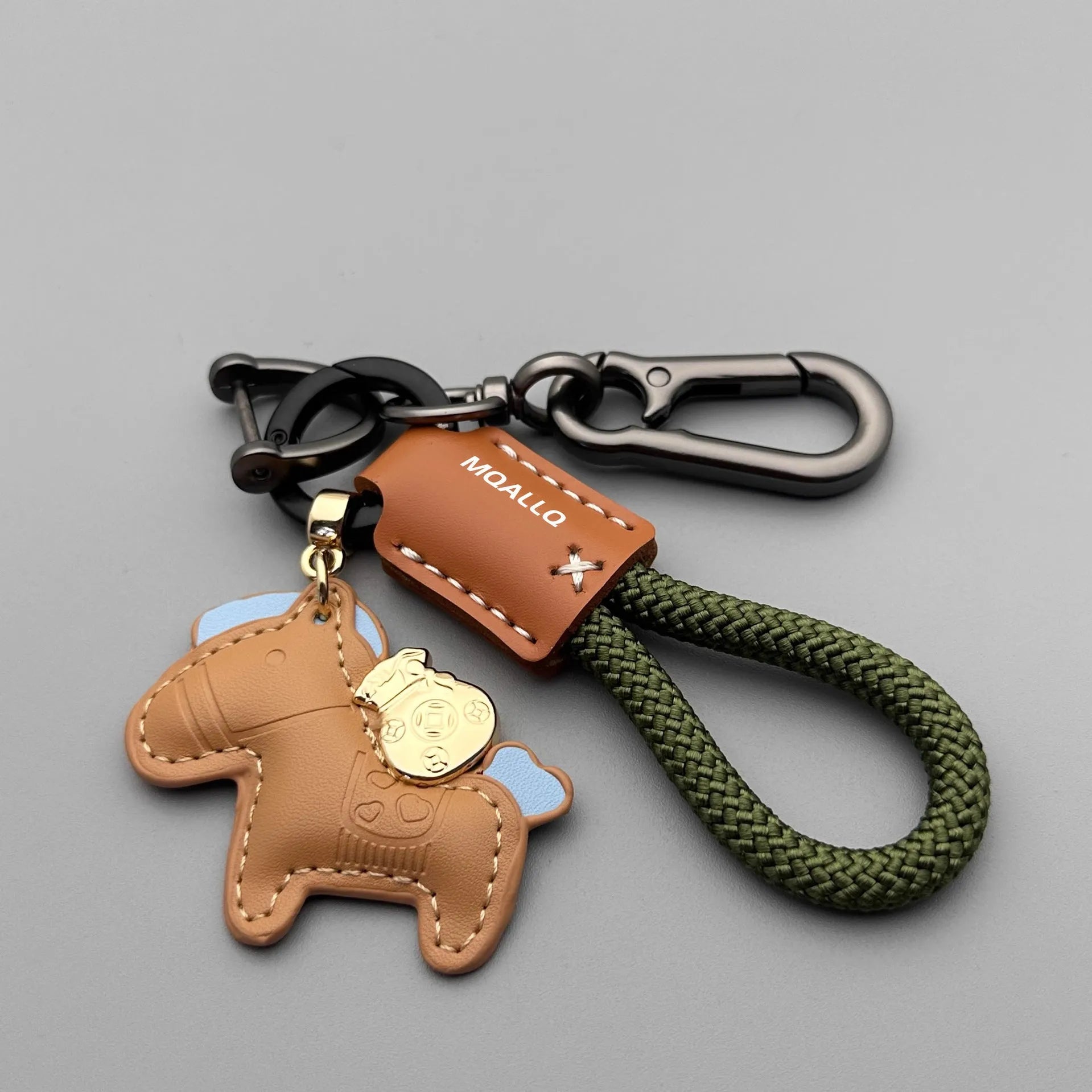 Handmade cowhide key ring pendant with a detailed zinc alloy pony buckle and coloured flannelette rope.