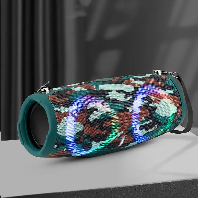 War Drum portable Bluetooth speaker in camouflage colour with dynamic RGB lights, showing carrying strap and control buttons.