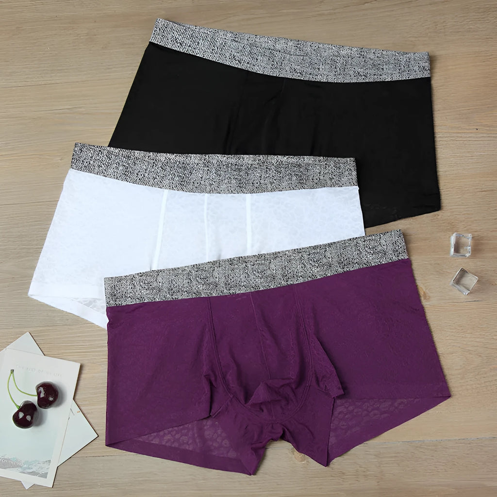 Men's seamless lace boxer briefs in jacquard fabric, shown in a choice of colours on a white background.