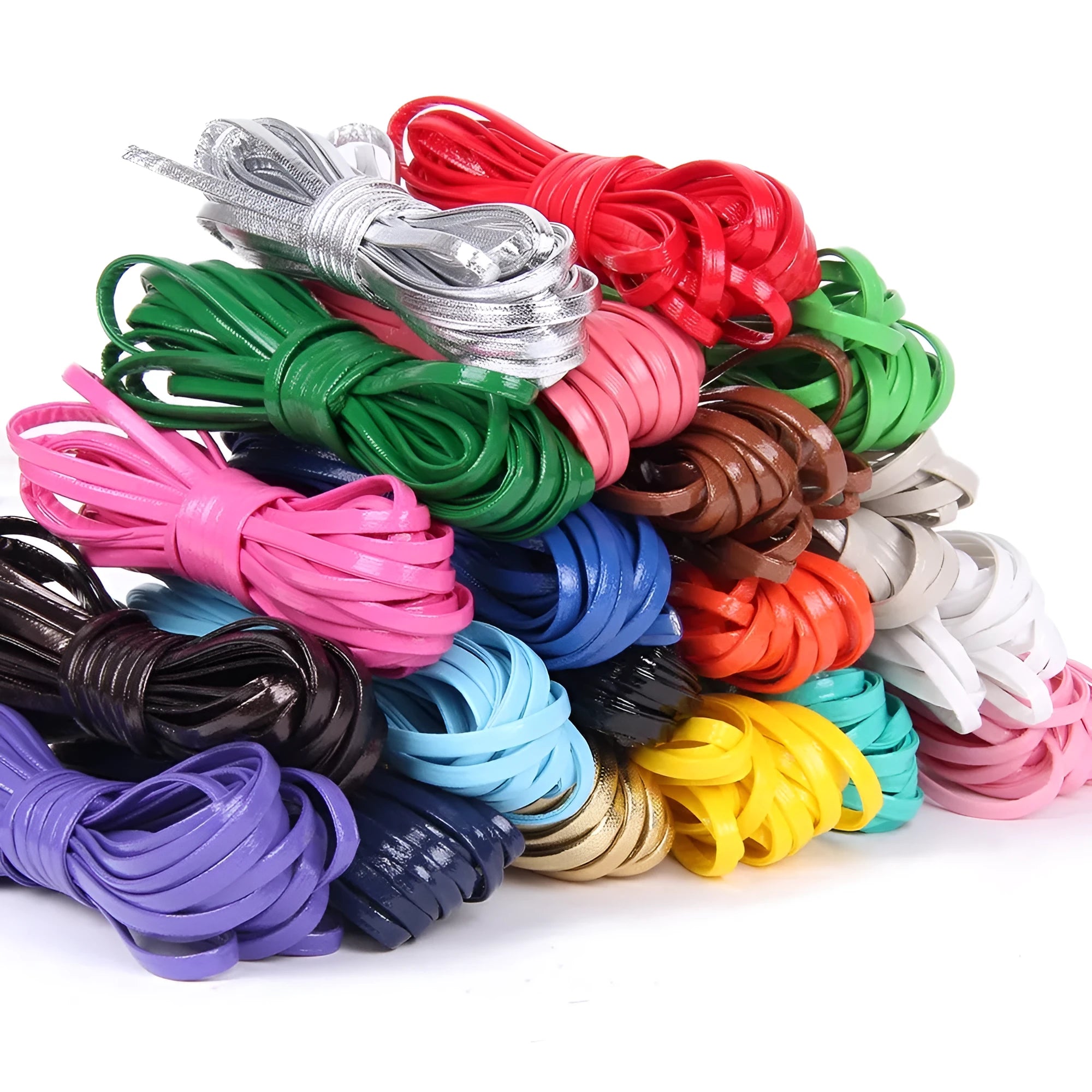 Spools of PU leather crafting cord in multiple colours including black, red, blue, and gold, showing different thicknesses.