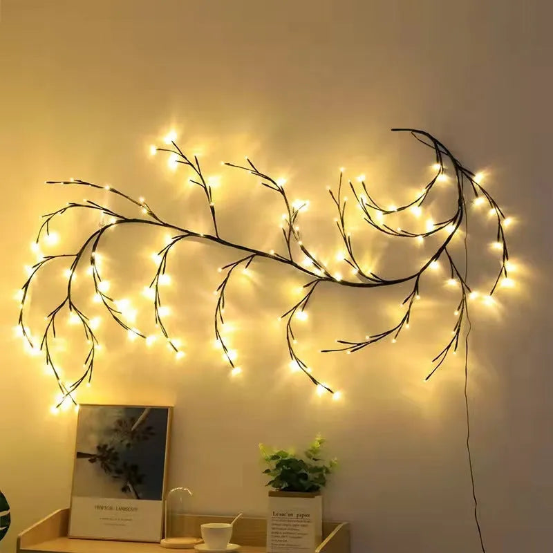 Flexible white birch texture LED vine garland with warm white lights bent into a decorative shape.