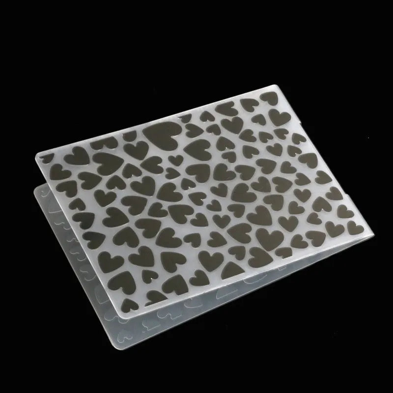 Plastic cake decorating mould showing windmill and flower shapes, folding size 14.5 by 10.5 cm.