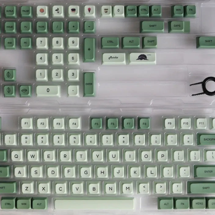 124 PBT dye-sublimation keycap set in matcha green colour on a keyboard.