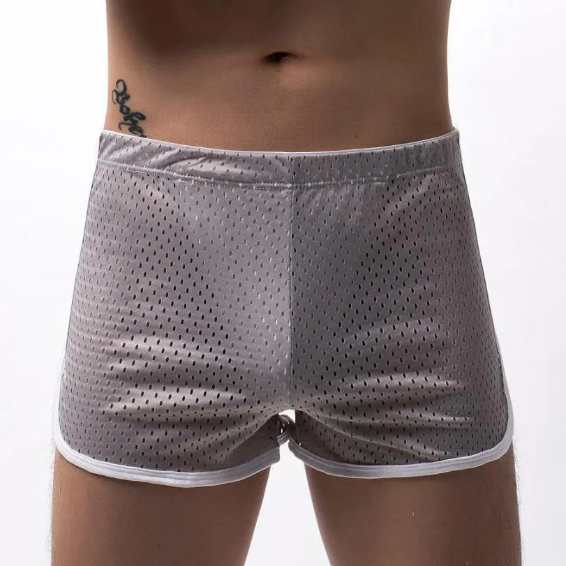 Men's black three-point boxer shorts with a mid-waistband, made from a breathable cotton and nylon fabric blend.