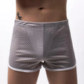 Men's black three-point boxer shorts with a mid-waistband, made from a breathable cotton and nylon fabric blend.