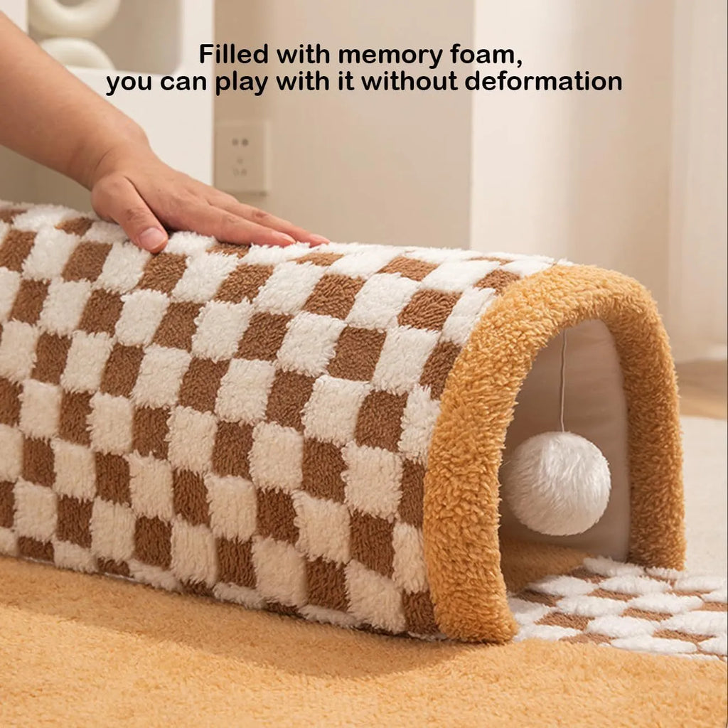 XL plush dog and cat bed with an attached tunnel in a plaid design, showing coffee colour and granular anti-slip bottom.