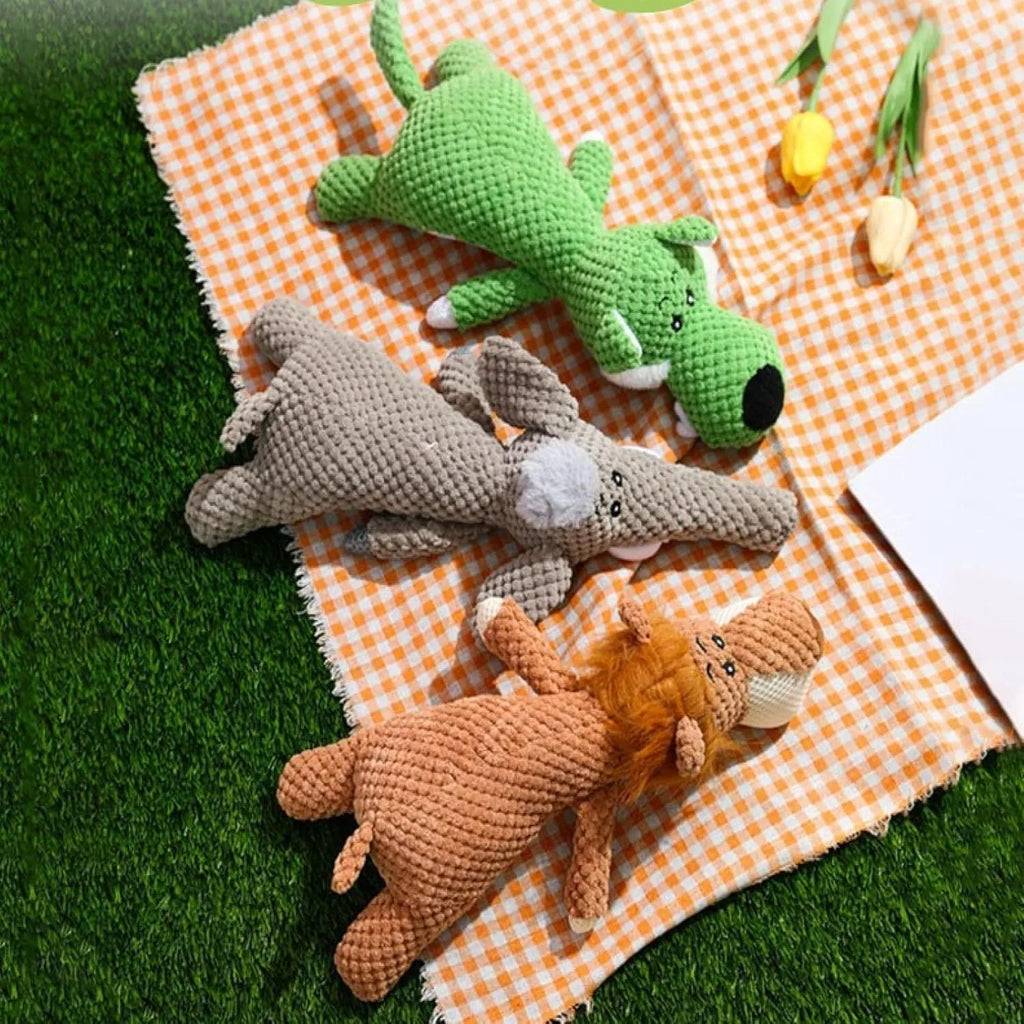 Animal-shaped plush dog toy with corn kernel texture for dental cleaning and squeeze-activated sound