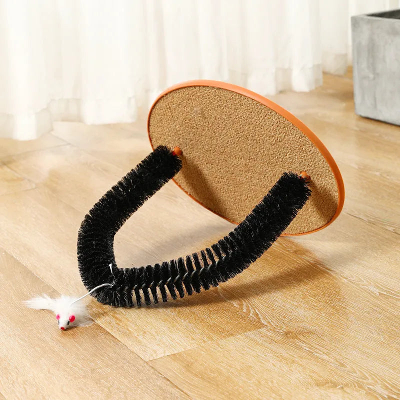 Black arch-shaped cat grooming brush with scratching surface and attached plush mouse toy on non-slip base
