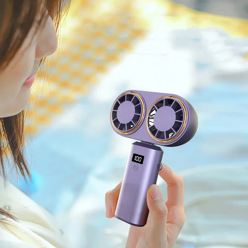 Foldable handheld USB fan with digital display, shown in milky white, unfolded for use.