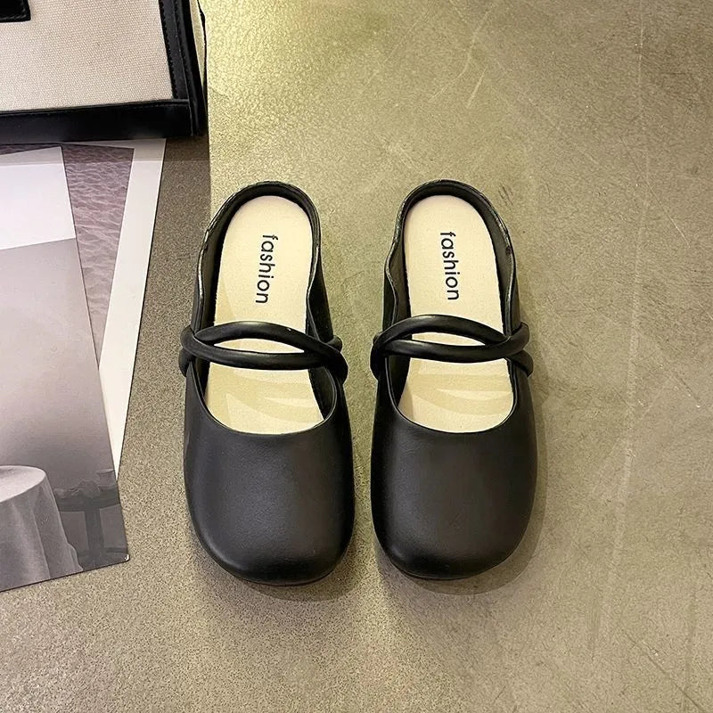 Women's black plastic toe cap flip-flop sandals on a white background.