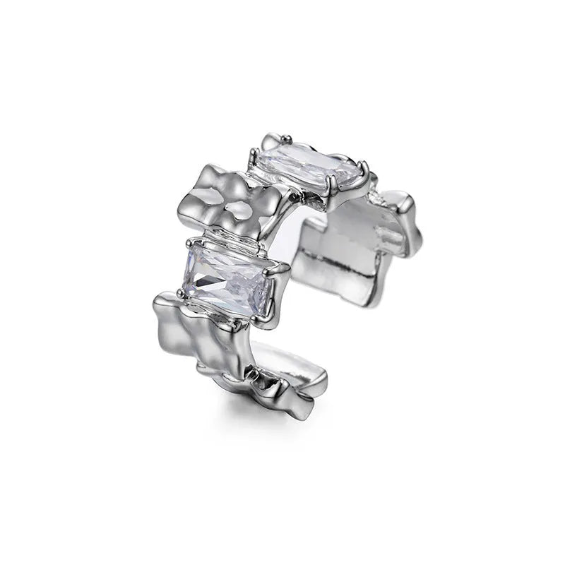 Silver cross ring with geometric design and open gemstone setting