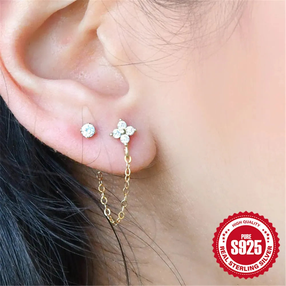 S925 sterling silver ear stud with gold electroplated flower and dangling tassel chain design.
