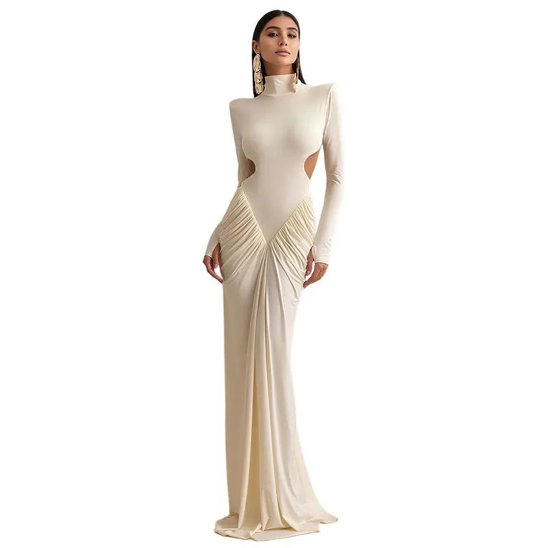 A woman's long sleeve high collar slim fit dress in a solid colour with a pleated backless detail.