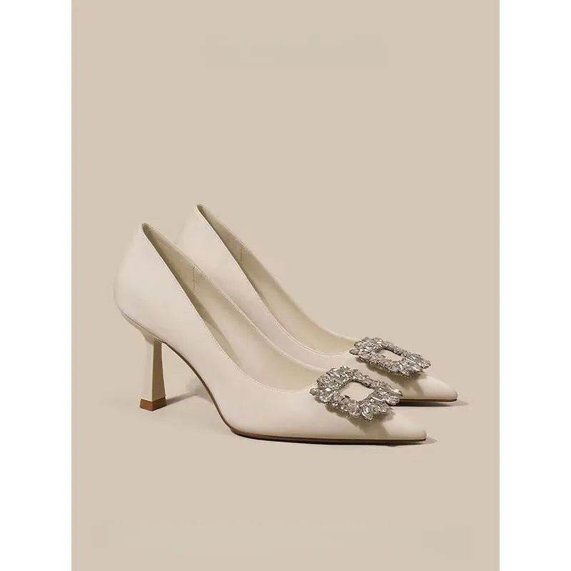Women's pointed toe stiletto pumps in microfiber with a mid heel and rubber sole.