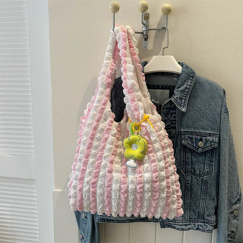 Soft pleated polyester women's crossbody bag in square shape with detachable pendant.