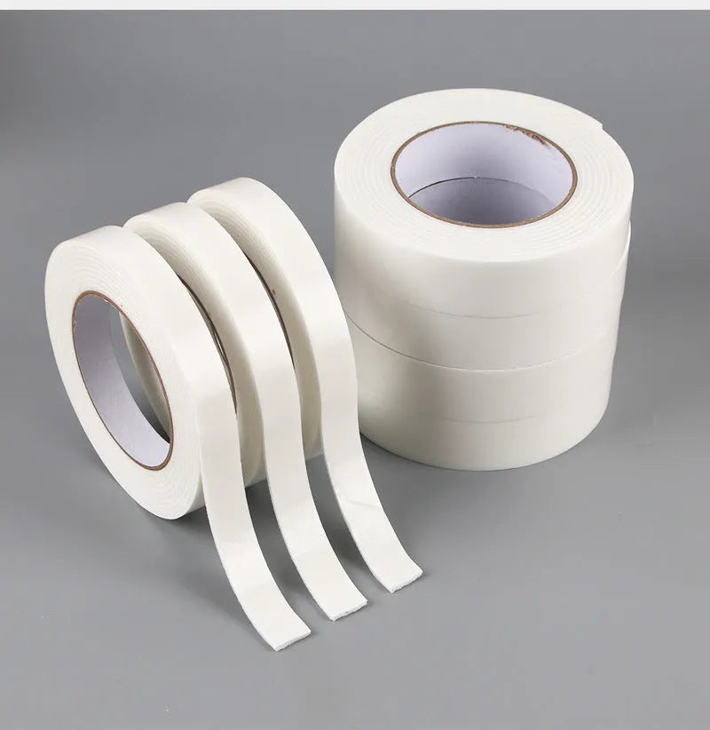 Roll of white foam double-sided adhesive tape showing its 3mm thickness and strong adhesive.