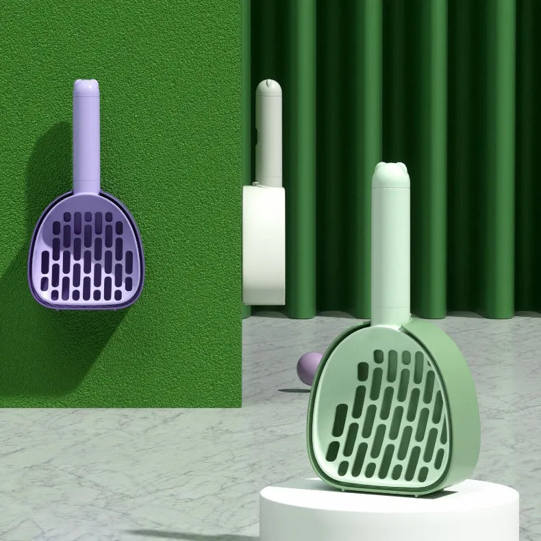 White ABS plastic cat litter scoop with a stand-up base and hidden bag storage compartment.