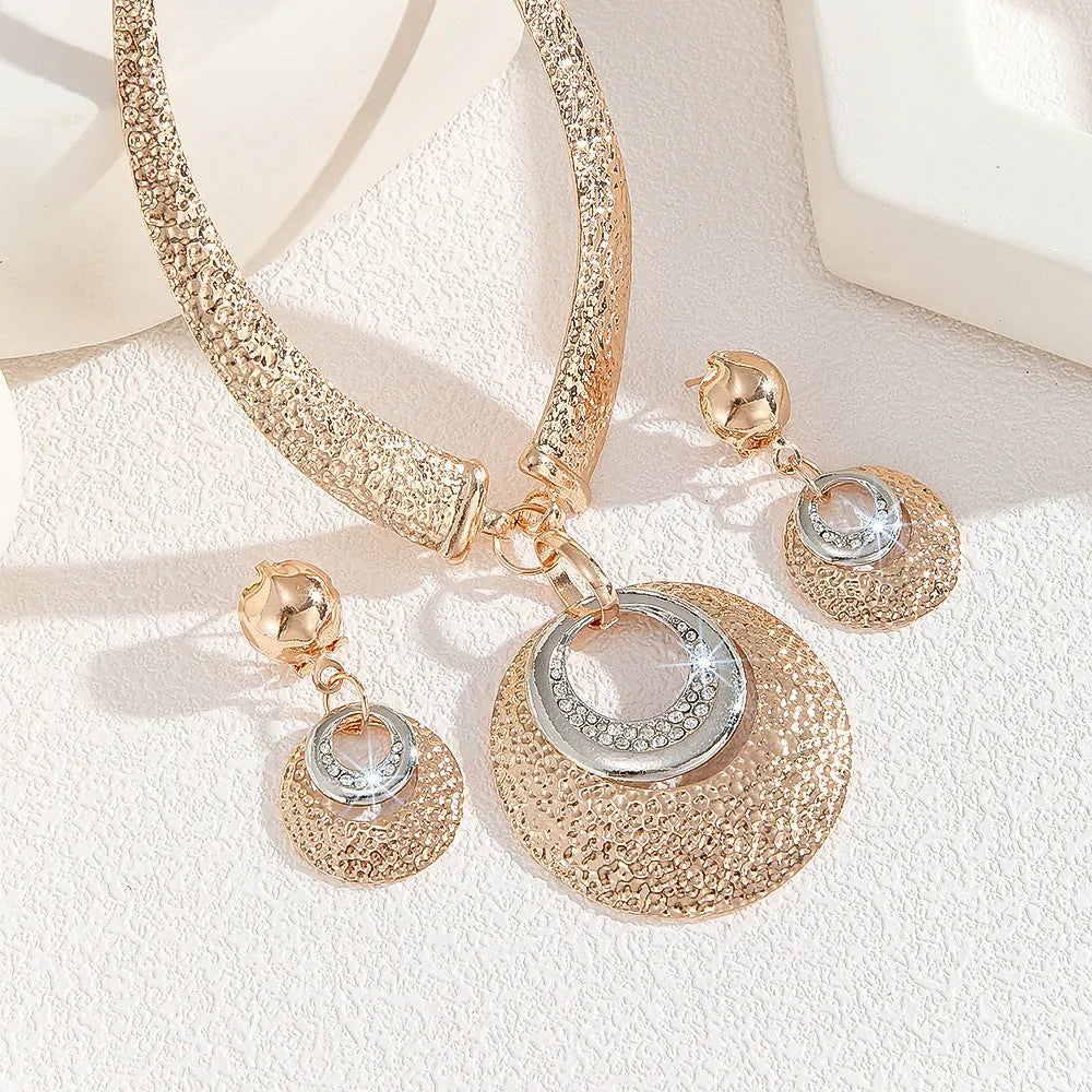 Gold alloy circle necklace and earrings set for women with celestial pattern options