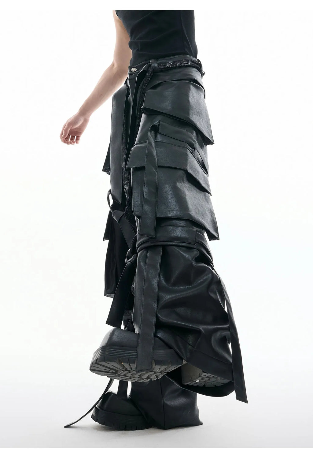 Black loose-fit quilted trousers with multiple pockets on a mannequin.